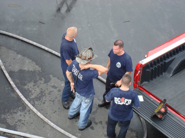 Traditions Training instructors discussing scenarios for the engine company class.