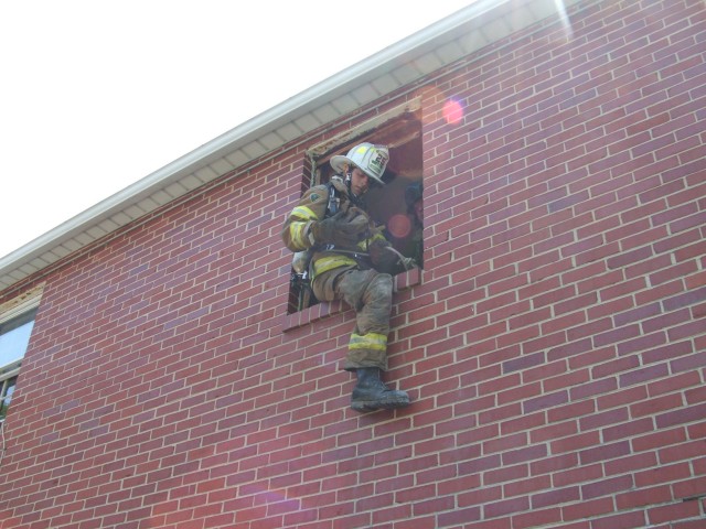 EMS Lt. Maurer learning firefighter survival tactics.