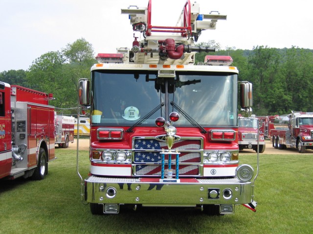 Ladder 25 displaying its 1st place trophy for best appearing and equipped Aerial device.